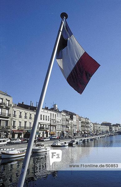 Close-up of French flag over canal  Port of Sete  France