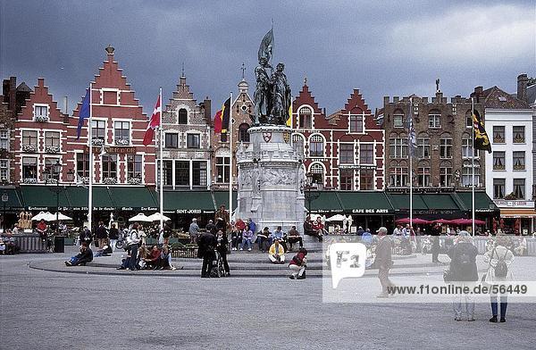 Tourists at market place near monument  Bruges  Belgium