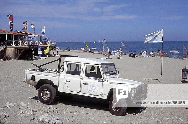 Tourists and jeep on beach  Leucat Plage  France