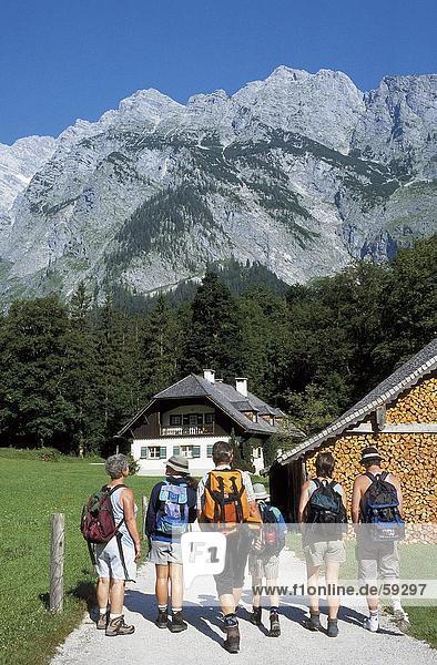 Group of tourists with backpacks    Alps Mountain Range  Germany  Europe