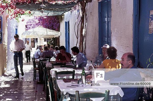 Tourists at outdoor cafe  Nafplio  Peloponnesus  Greece