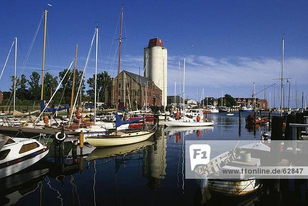 Boats moored at harbor  Fehmarn Island  Schleswig-Holstein  Germany