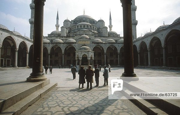 Tourists in courtyard of mosque  Blue Mosque  Istanbul  Turkey