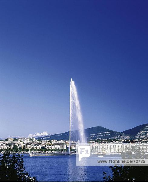 10370528  mountains  town  city  of Geneva  Switzerland  Europe  lake Geneva  houses  homes  hills  jet d'Eau  fountains  Swit