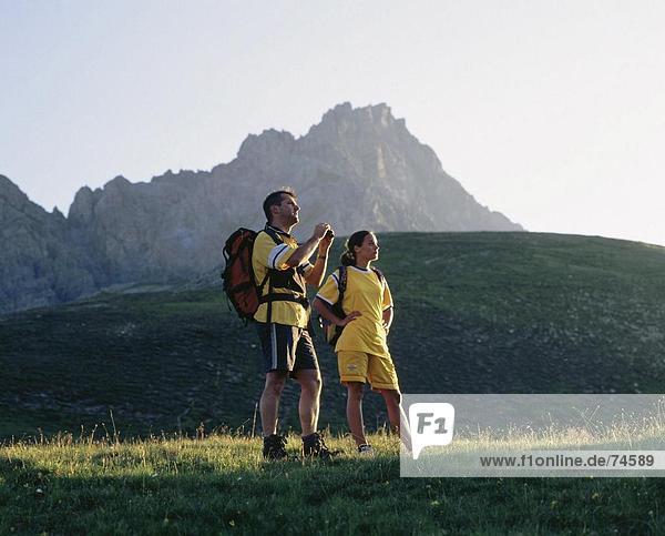 10625285  mountain  binoculars  Switzerland  Europe  Graubunden  Grisons  morning mood  national park  pair  couple  backpack
