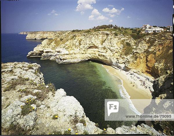Felsbrocken Landschaftlich schön landschaftlich reizvoll Mensch Menschen Blume Wohnhaus Strand Gebäude Steilküste Meer Algarve Bucht Carvoeiro
