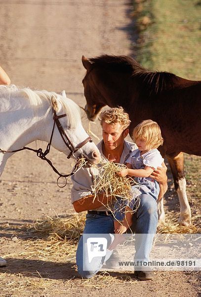 Family. Father & children. Outdoors. Horse