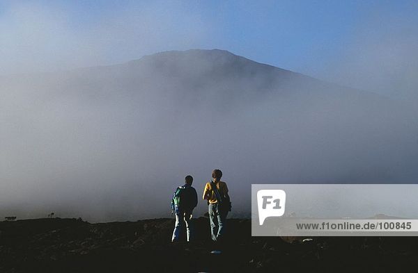 Two hikers on mountain  Reunion Island  France