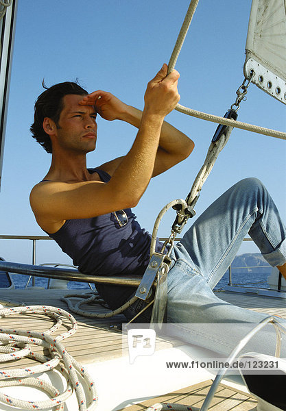 Man on sailing boat