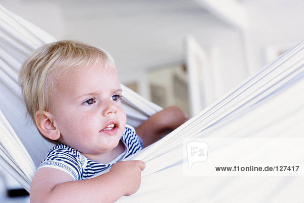 Portrait of a baby boy in a hammock
