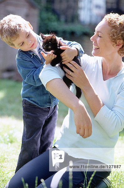 Mother and son with cat