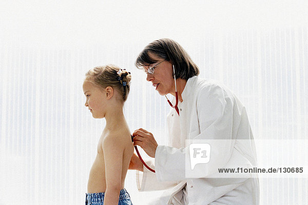 Girl being examined by doctor