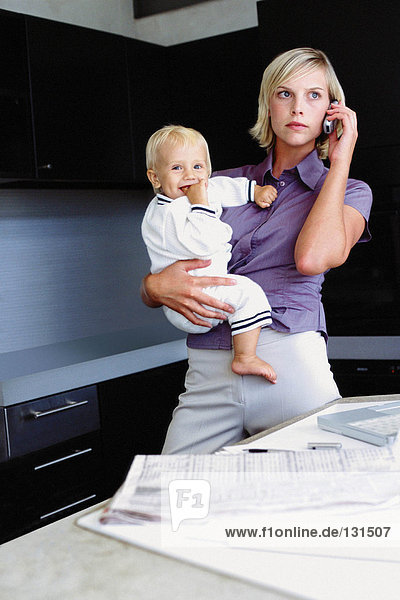 Woman and infant in kitchen