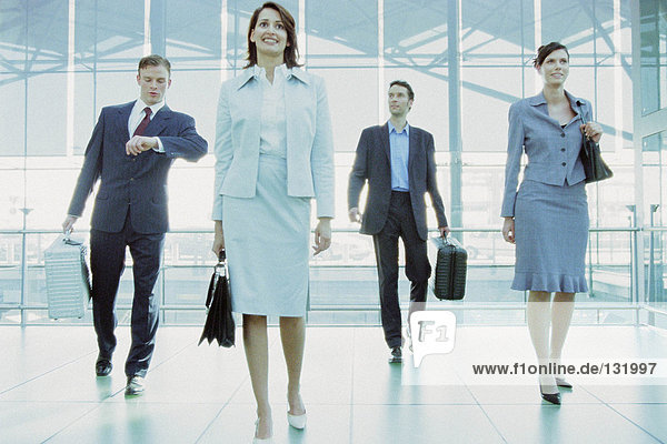 Businesspeople in airport terminal