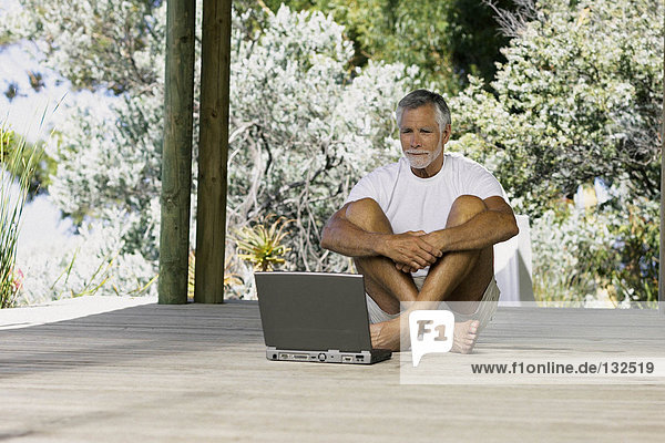 Man outside with computer