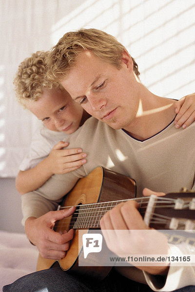 Father and son with guitar