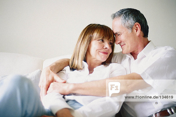 Man and woman together on sofa