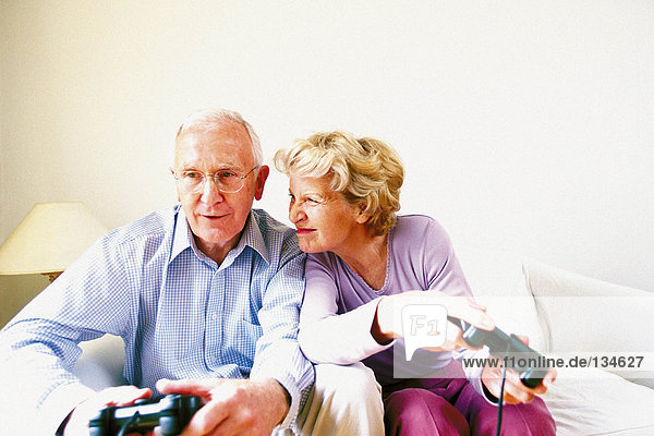 Man and woman playing computer game