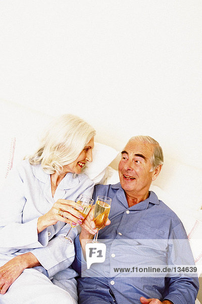 Man and woman proposing toast