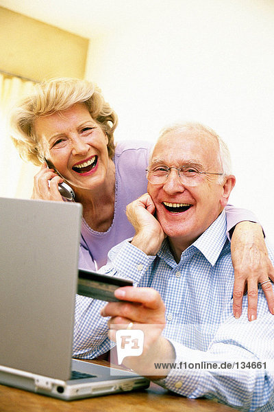 Man and woman using laptop computer