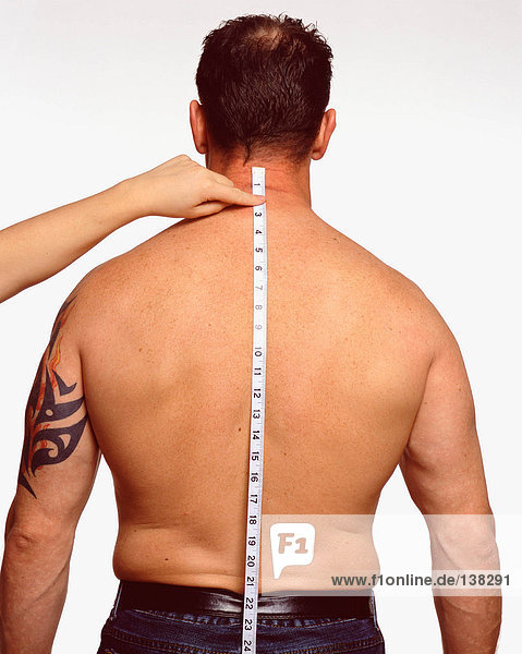 Measuring along male back
