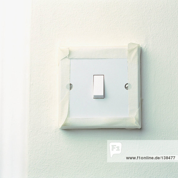 Light switch with masking tape