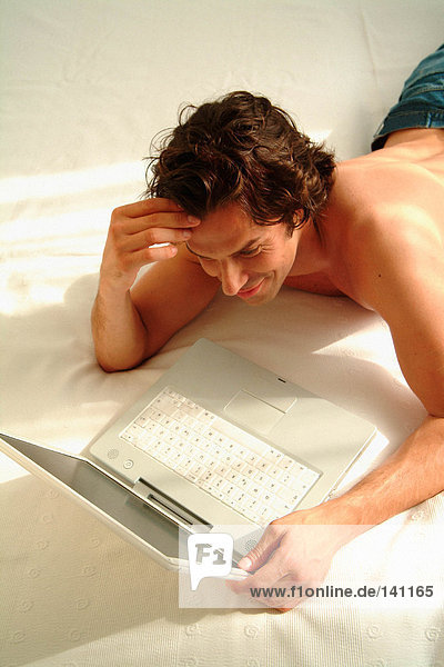 Man at home with laptop