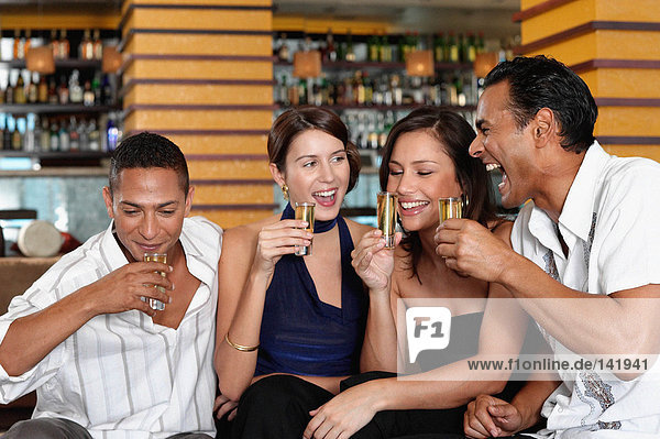 Friends drinking in bar