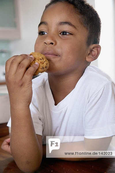 Boy eating a cookie