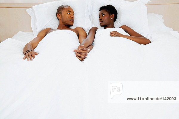 Couple lying in bed