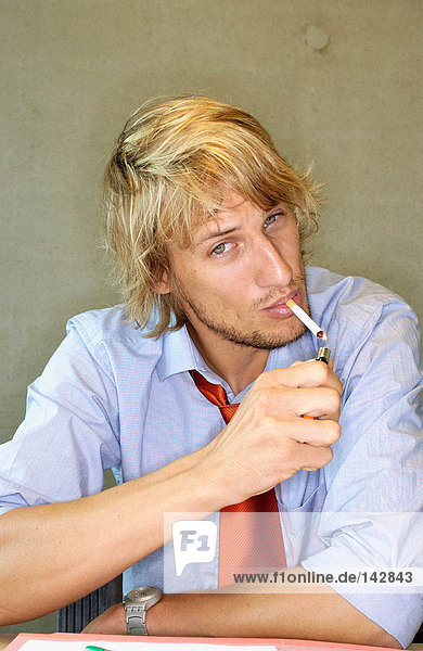 Office worker smoking a cigarette