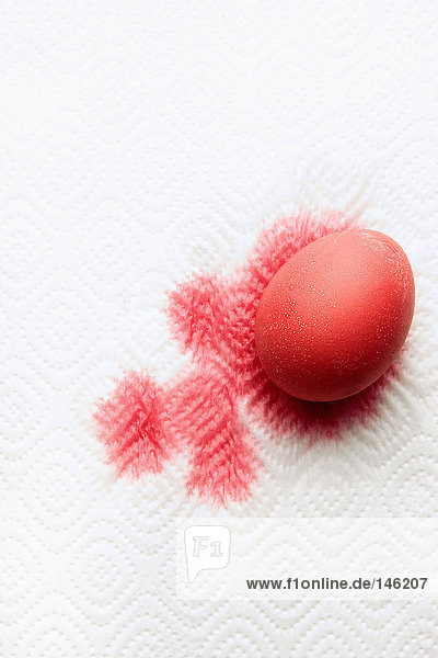 Egg covered in red paint