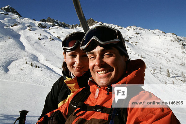 Couple on a ski lift