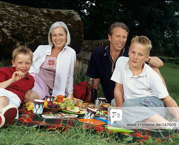 Family portrait at a picnic.
