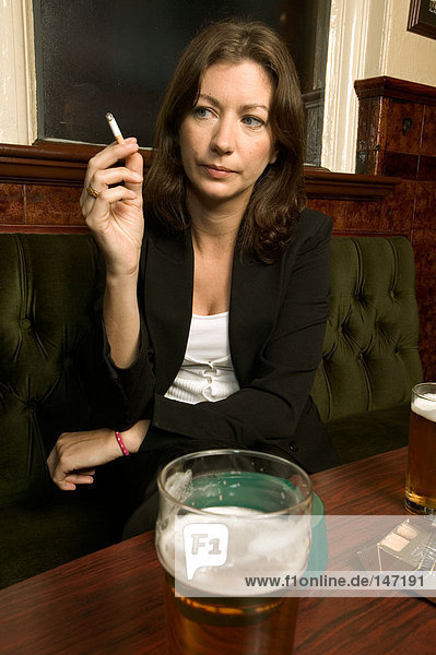 A businesswoman smoking