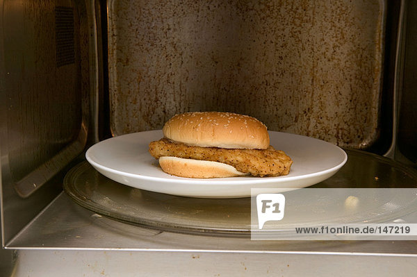 Chicken burger in a microwave