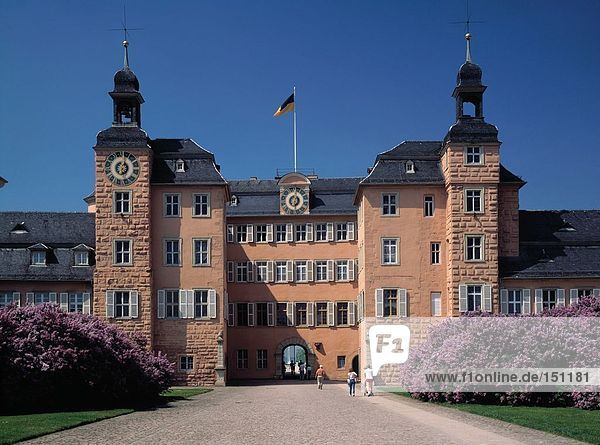 Tourists in front of castle Schwetzingen Germany