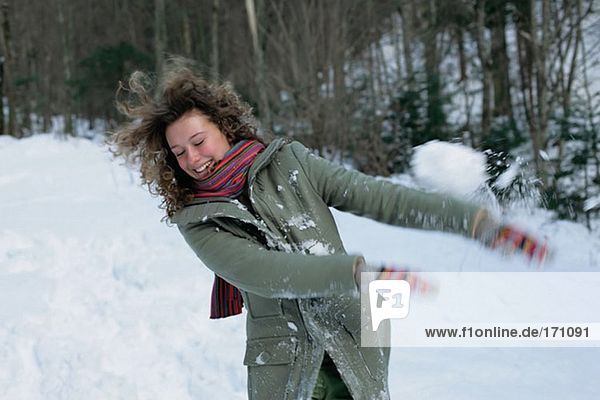 Woman in snowball fight