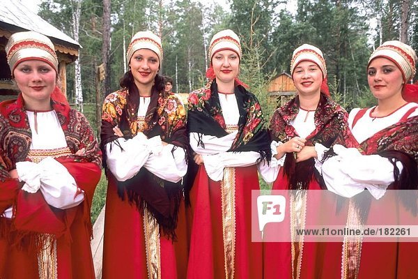 Russian women smiling in traditional clothing  Siberia  Russia