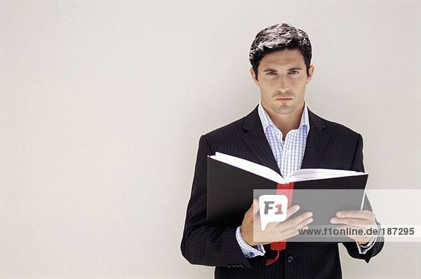 Businessman holding a notebook