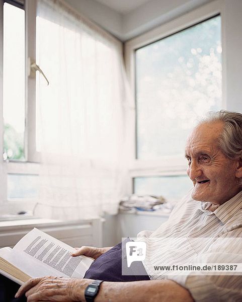 Elderly man with book