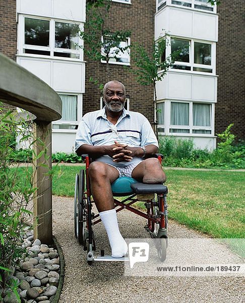 Man in wheelchair in garden