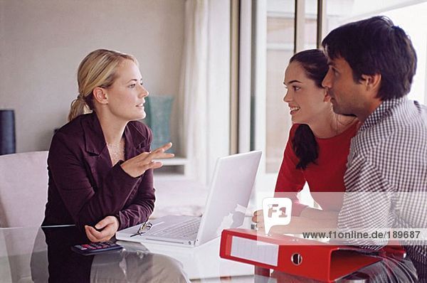 Couple meeting with a financial adviser