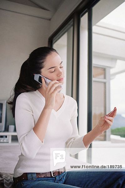 Woman using credit card over the phone