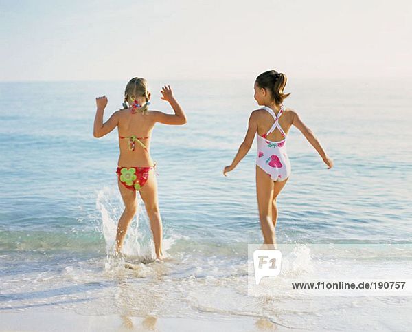 Girls splashing in the sea