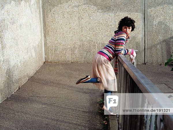 Woman leaning on a railing