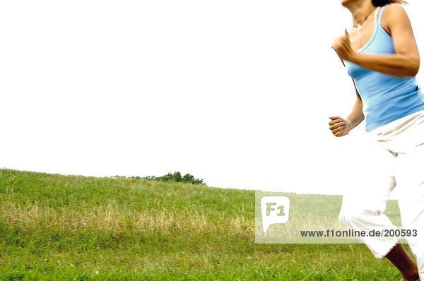 Woman jogging in field