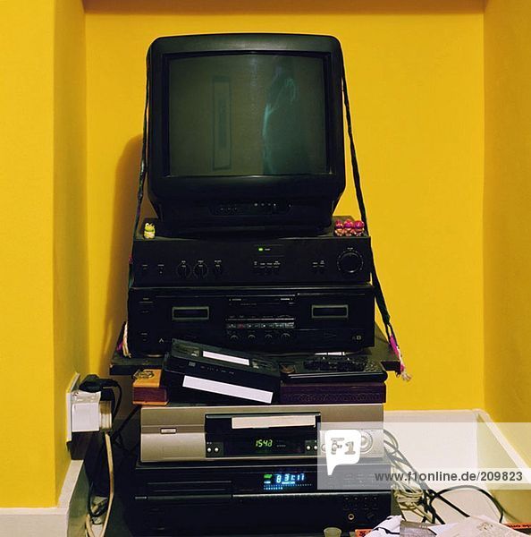 Television on stack of electrical equipment