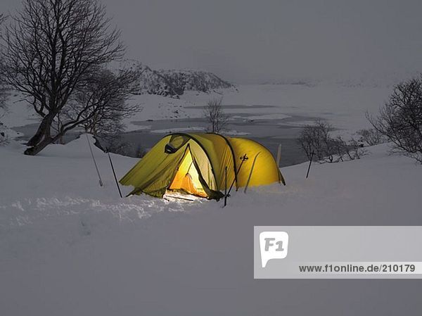 Yellow tent in the snow