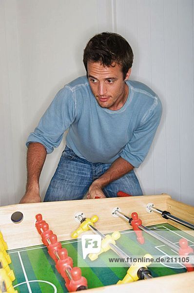 Man playing table football